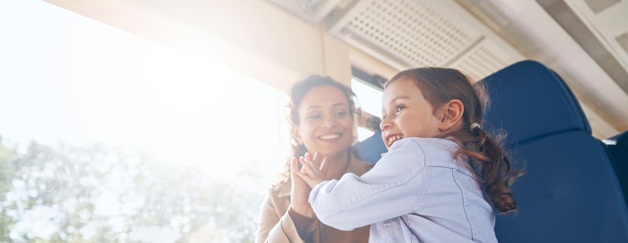 a woman and her daughter on a train